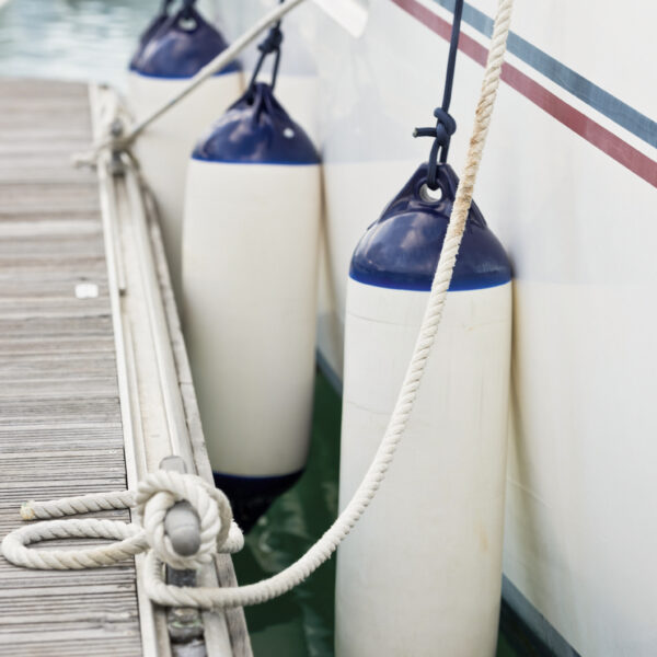 Sailboat Side Fenders CloseUp. Boat protection. Vertical shot