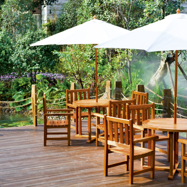 House patio with table and chairs under umbrella